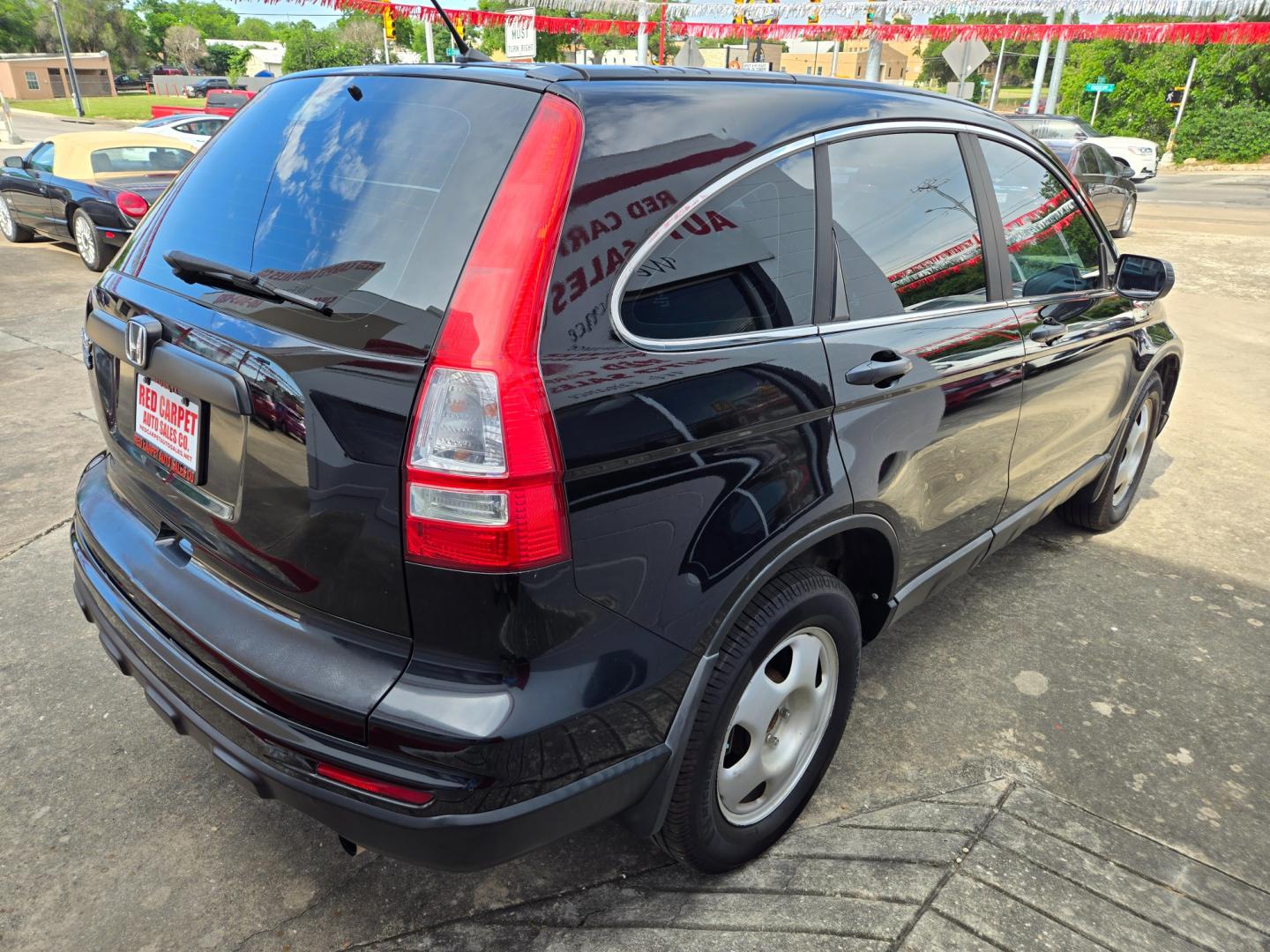 2010 Black Honda CR-V LX 2WD 5-Speed AT (5J6RE3H38AL) with an 2.4L L4 DOHC 16V engine, 5-Speed Automatic transmission, located at 503 West Court, Seguin, TX, 78155, (830) 379-3373, 29.568621, -97.969803 - Photo#2